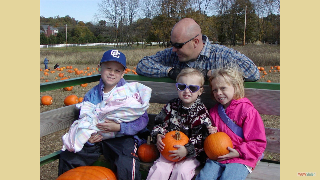 Patrick holding Grace, Abby, Shelby with Mike in background