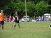 Ross (in black) at soccer game.